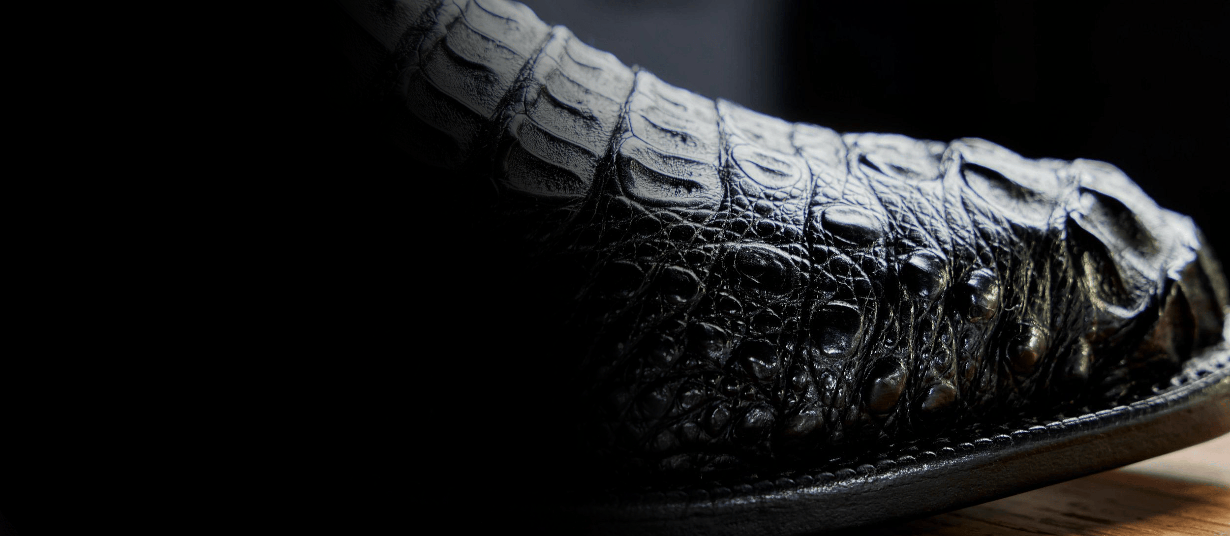 The toe of the Elio black caiman western boot. Shop the Elio.